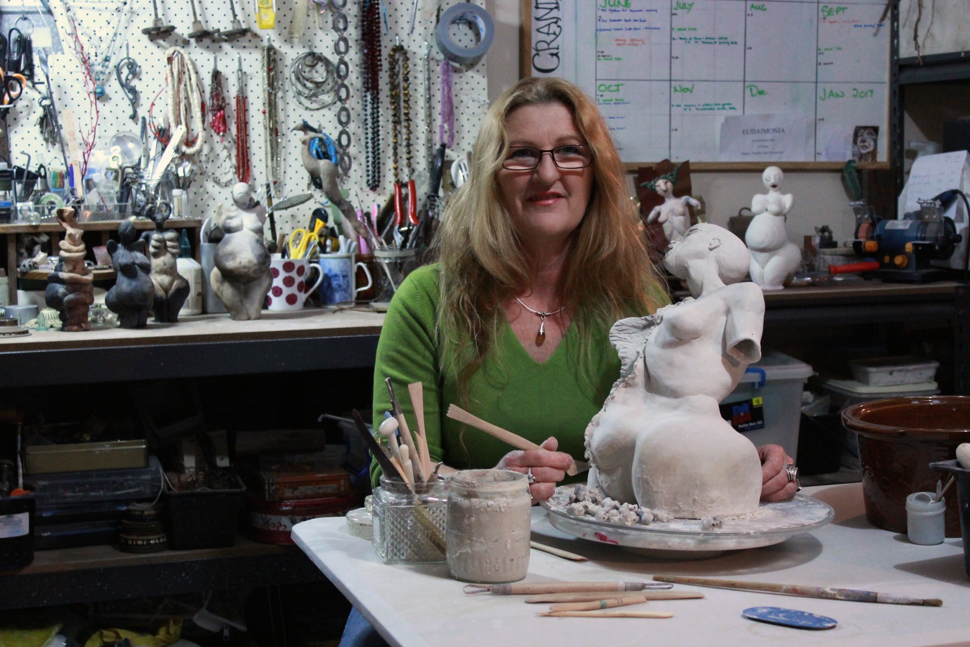 Carolyn Warren-Langford in her studio with one of her ‘Pyre Born Women’. Image by Caroline Esbenshade