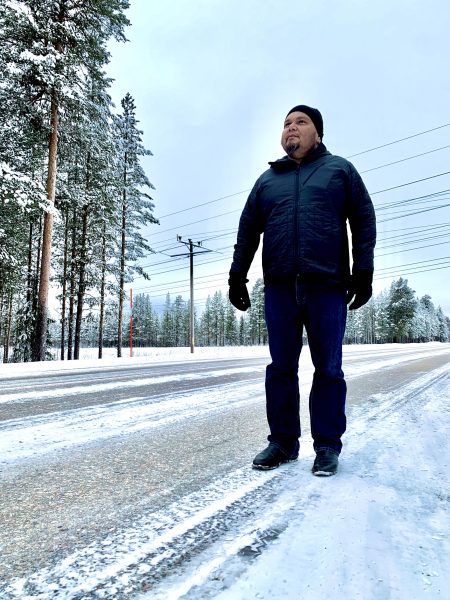 Tyson Mowarin hitchhiking to Jokkmokk, Sweden in the Arctic Circle 2019.